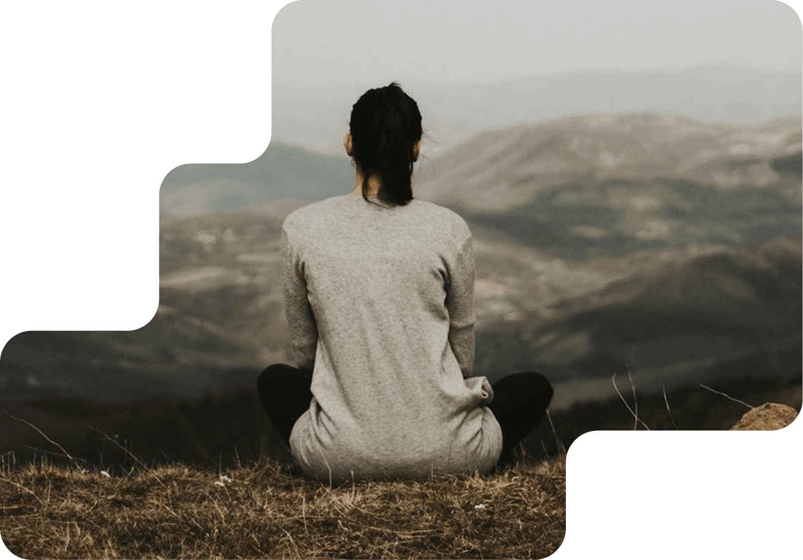 Person sitting peacefully in nature